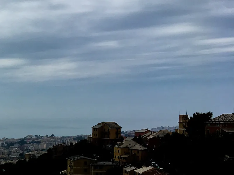Clouds over the Lugurian Sea hide the mountains behind.