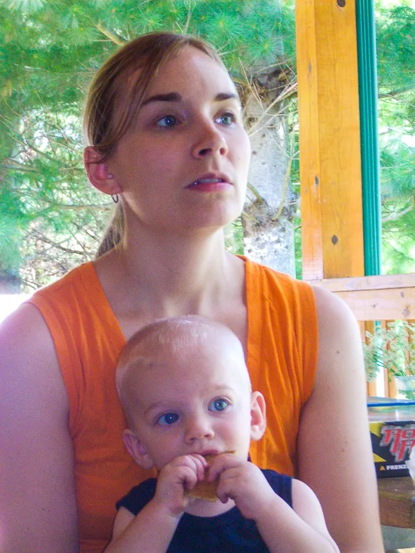 mother holding child in lap