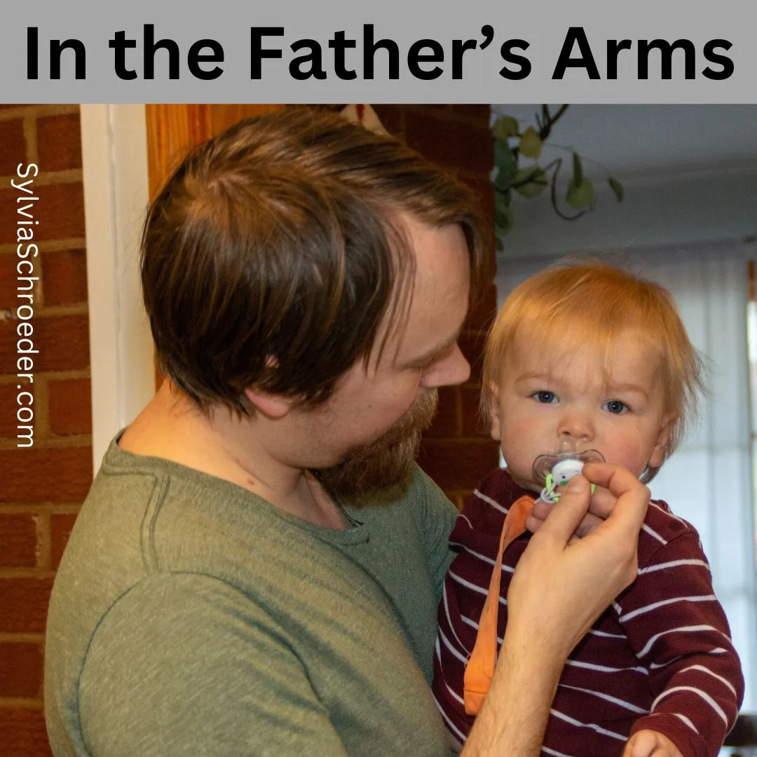 In the father’s arms