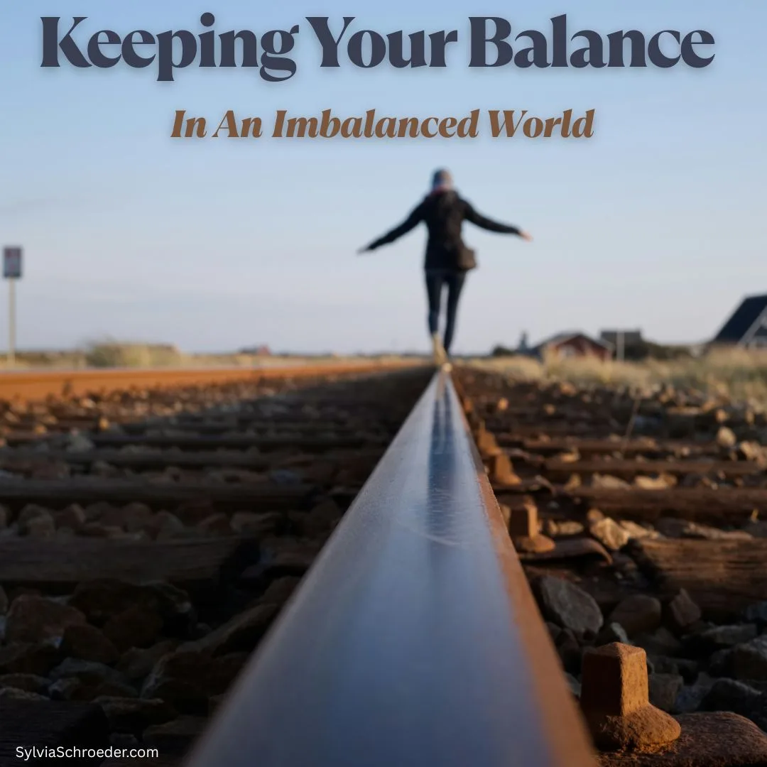 lady balancing and walking on a train rail.