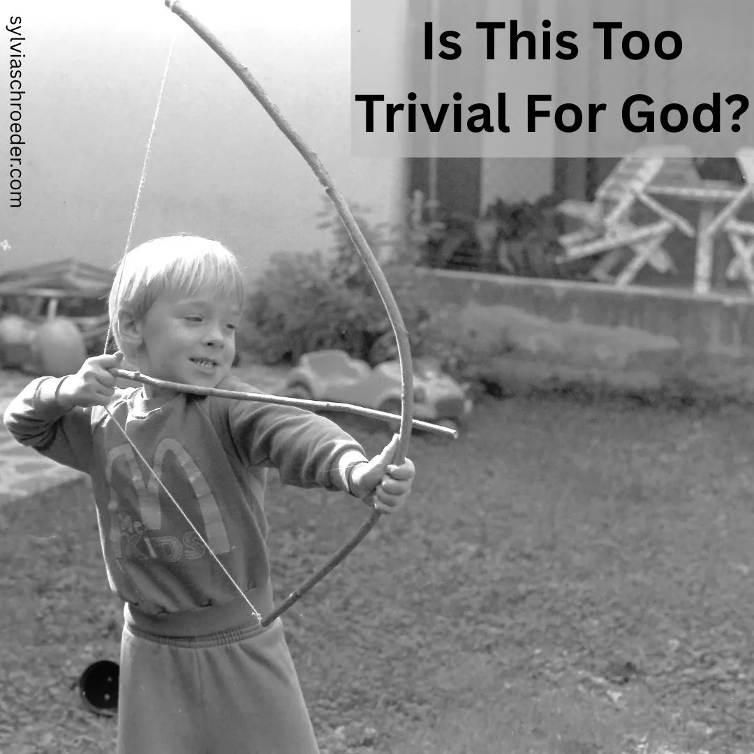 boy shooting a bow and arrow.