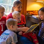 Mother Reading to her four children.