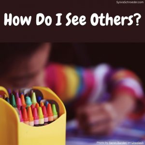 child coloring in a coloring book
