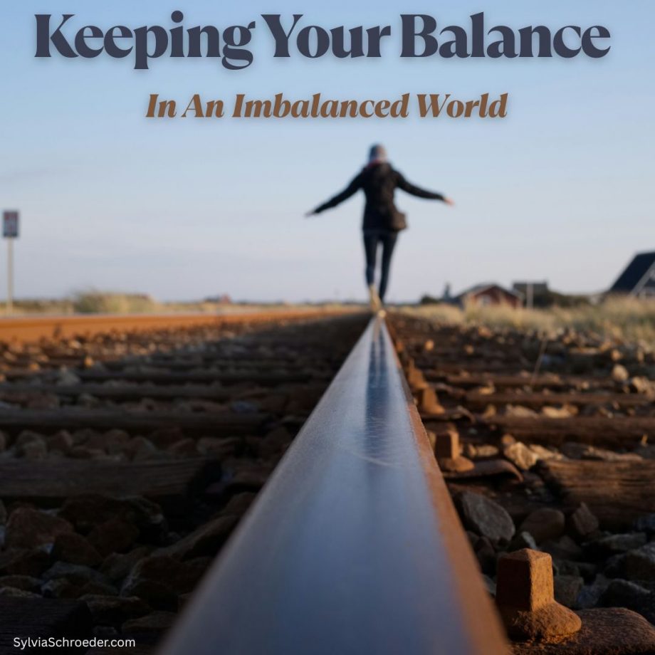 lady balancing and walking on a train rail.