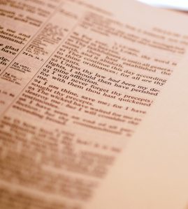 Bible text blurred and unable to see clearly